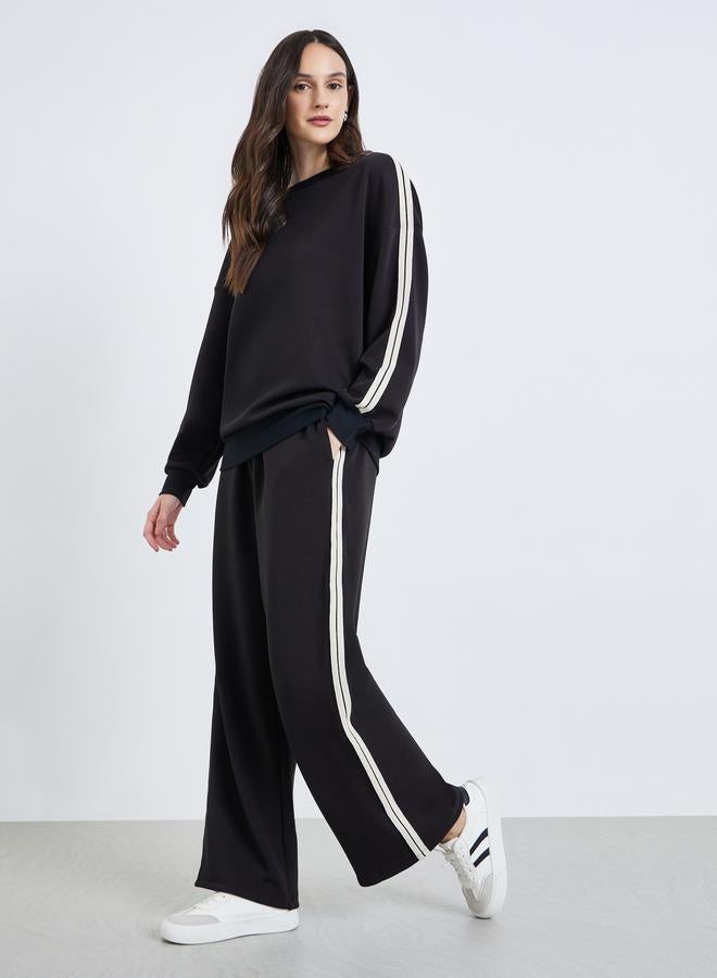 Styli Women Black Wide Leg Joggers with Stripe Detail - Image 1